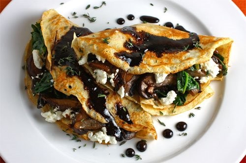 Mushroom and spinach crepes with goat cheese and balsamic drizzle