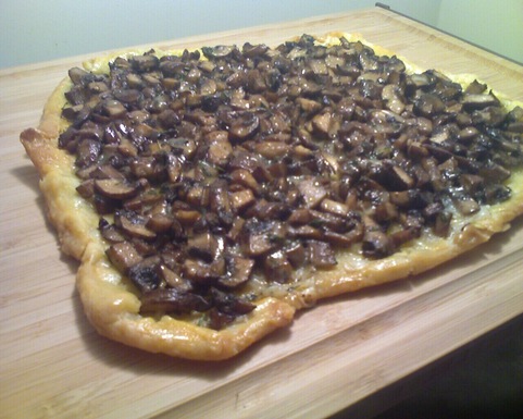 Mushroom crostata with roasted garlic, Taleggio, and thyme  