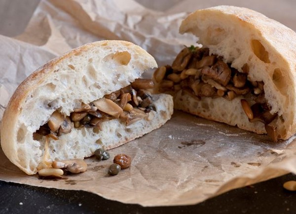 Mushroom sandwich with pine nuts, raisins and capers