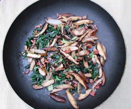 Mushroom saute with greens, pancetta, and wild mushroom-infused olive oil