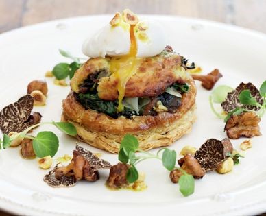 Mushroom tart with Yorkshire blue rarebit (Truffled mushroom and spinach tart with Yorkshire blue rarebit, poached guinea fowl egg and cobnut dressing)