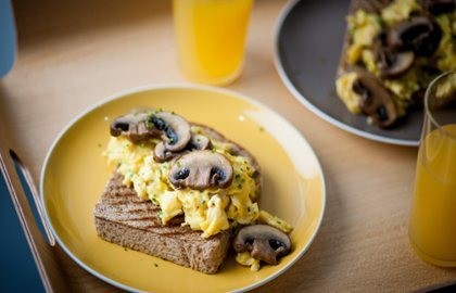 Mushrooms on toast with scrambled eggs and mushroom ketchup