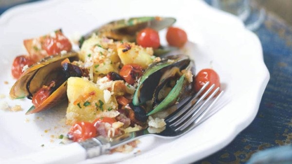 Mussels baked with pancetta, potatoes and cherry tomatoes