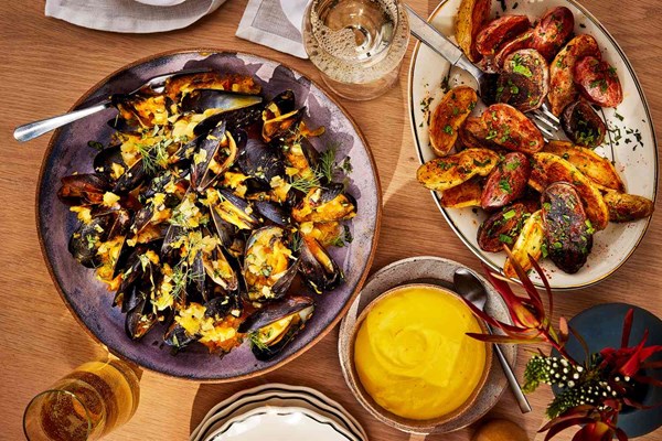 Mussels with saffron aioli, yellow tomatoes, and roasted fingerlings