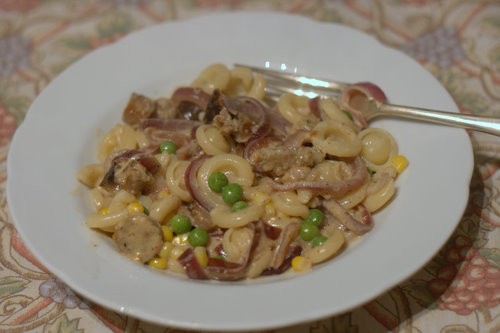 Mustardy sausage and sticky onion pasta