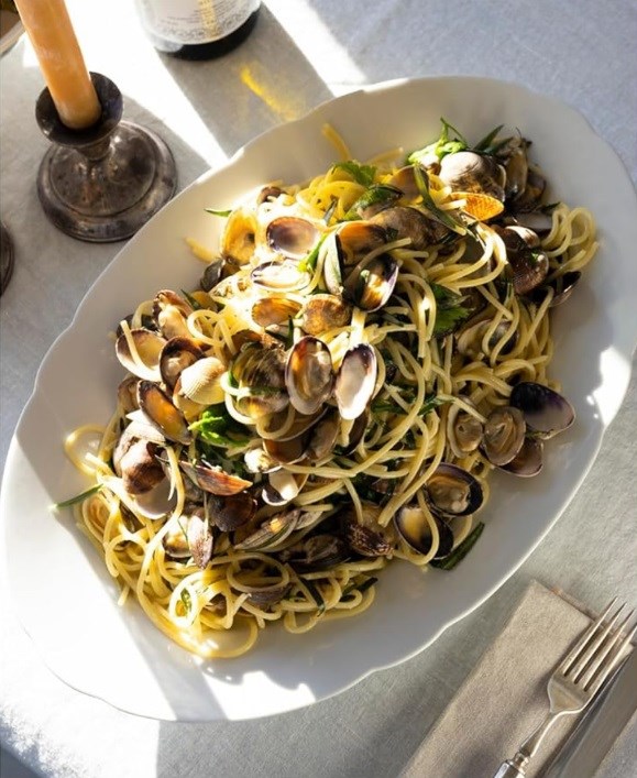 My favorite spaghetti with clams, crème fraîche, and green herbs