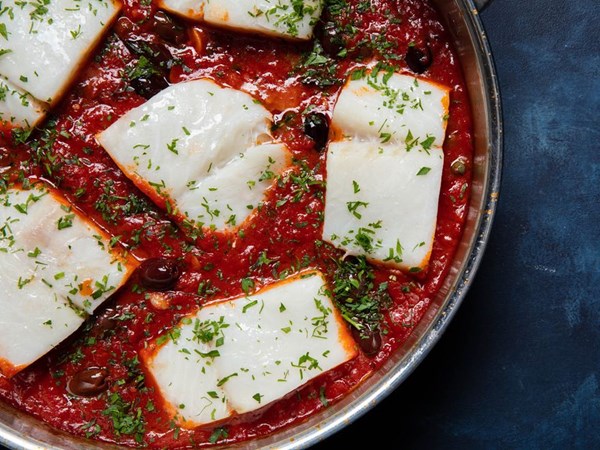 Neapolitan-style braised salt cod with tomatoes, olives, and capers (Baccalà alla Napoletana)