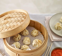 Nepalese prawn momos with cherry tomato chutney