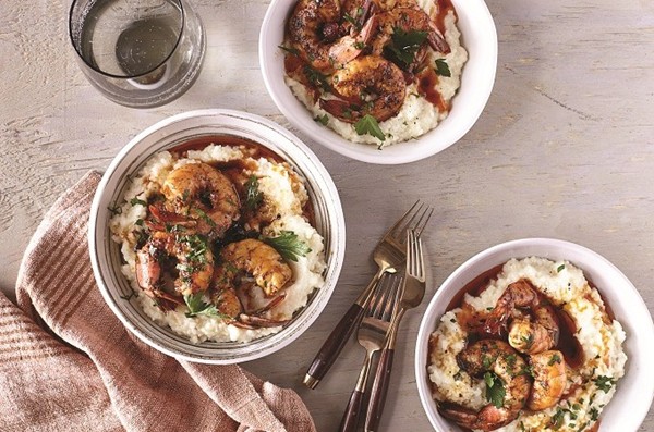New Orleans-style barbecue shrimp with cheese and bacon grits