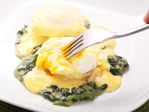 New Orleans-style poached eggs with artichoke hearts, spinach, and Hollandaise (Eggs sardou)