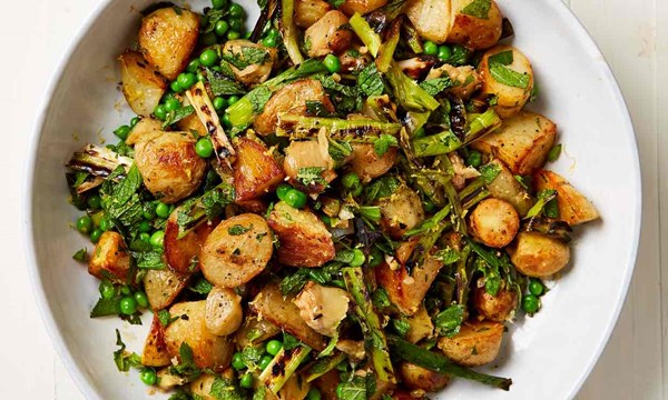 New potatoes with burnt spring onions and peas