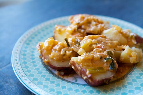 New potatoes with cheese and tomatoes