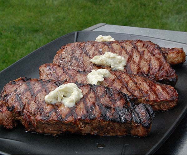 New York strip steaks with blue cheese butter