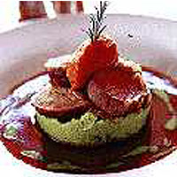 Noisettes of English lamb with apricot and almond stuffing, pea mash and tomato compote