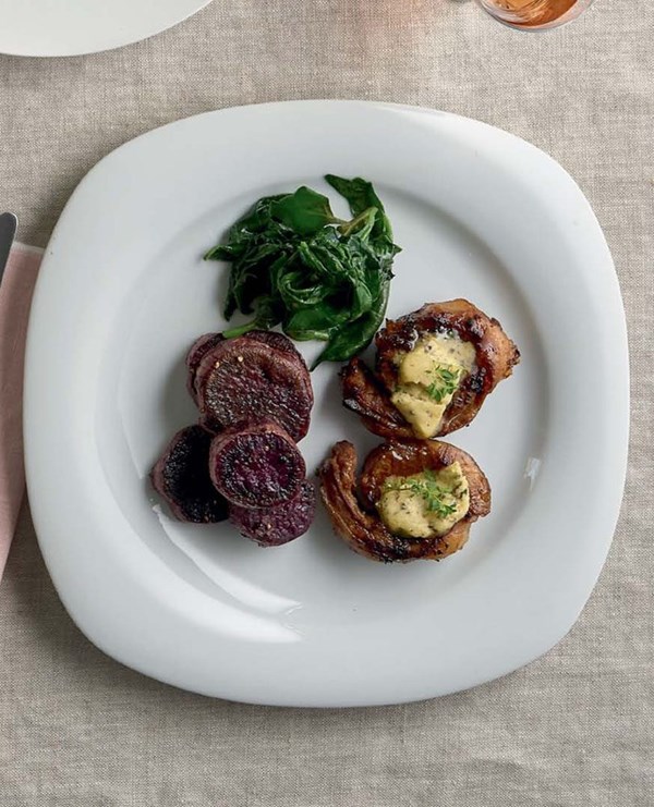 Noisettes of lamb with honey & herb butter, kumara discs & wilted greens