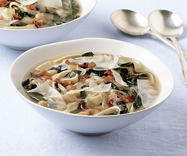 Noodle soup with white beans and collards