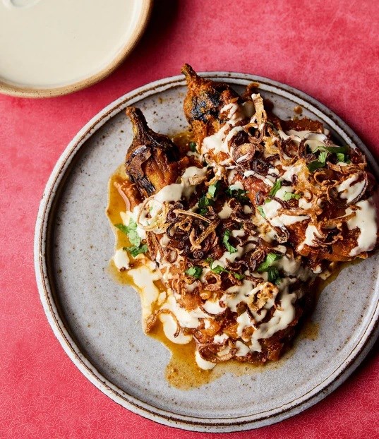 Noor's burnt aubergines with fenugreek sauce, tahini and fried shallots 