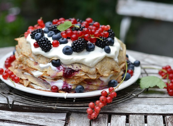 Nordic pancake cake with forest berries and cultured cream