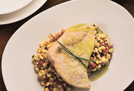 Oil-poached swordfish with white corn, guanciale, and chive oil