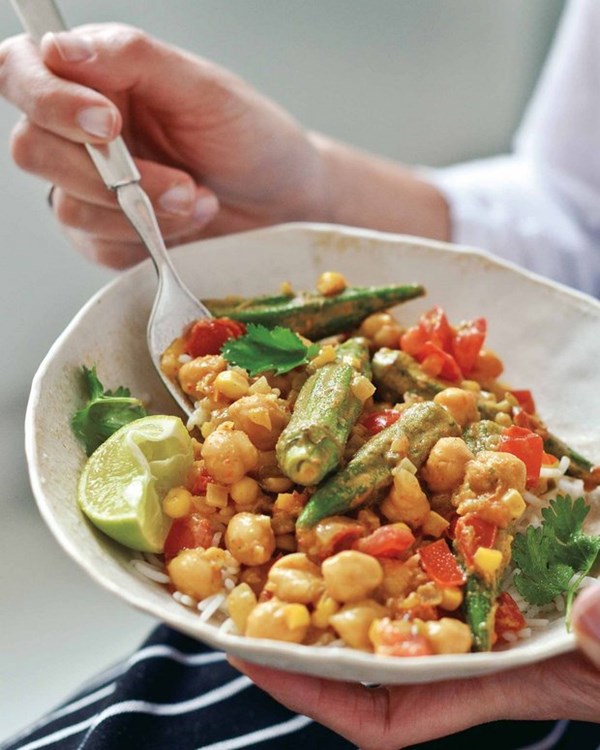 Okra, corn, and tomato curry with cilantro and lime