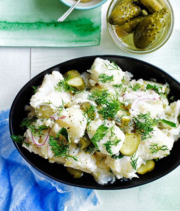 Old-school German-style crushed potato salad with dill pickles