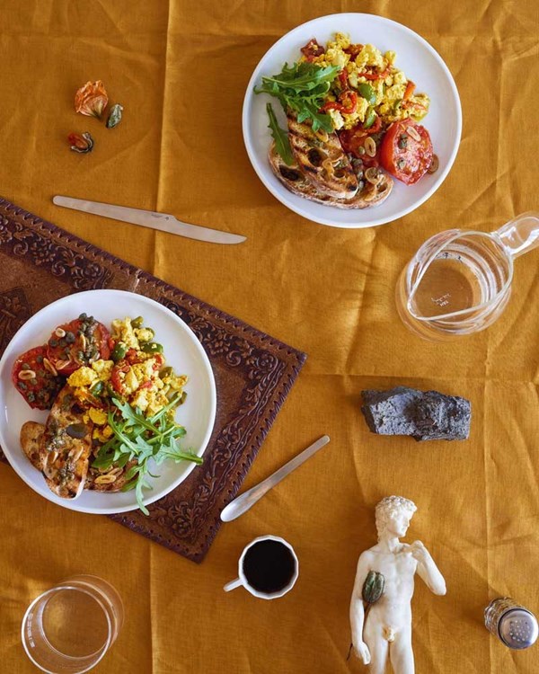 Olive & tofu scramble with stewed tomato & caper toasts