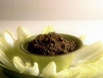 Olive and sun-dried tomato tapenade with endive leaves