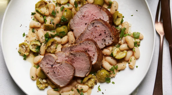Olive brine-marinated pork with roasted olives and beans