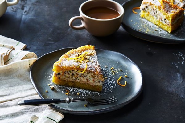 Olive oil cake with crème fraîche, pistachios, orange, and chocolate