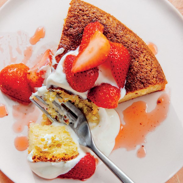 Olive oil cake with honey-yogurt cream and strawberries