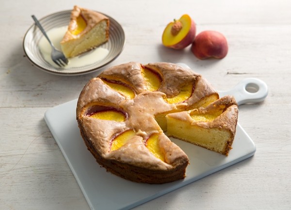 Olive oil cake with peaches and a lemon glaze