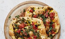 Olive-oil flatbreads with three-garlic butter and tomato