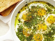 Olive oil-fried eggs with a crown of herbs