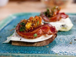 Olive oil-poached eggs with crisp pancetta and tomato-mustard seed relish