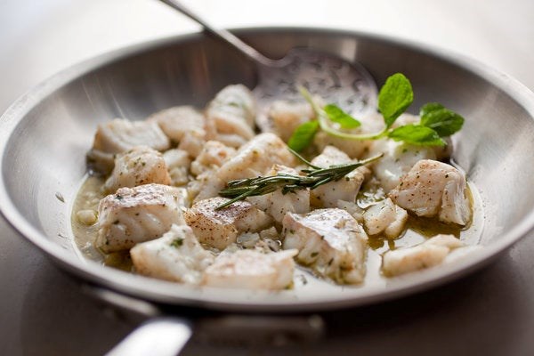 Olive oil-poached halibut nuggets with garlic and mint