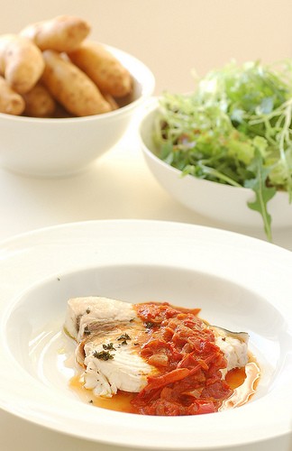 Olive oil poached swordfish with smoky paprika & onion sauce