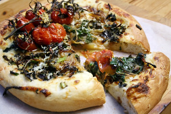 Olive oil white sauce pizza with caramelised onions, kale, spinach and tomato