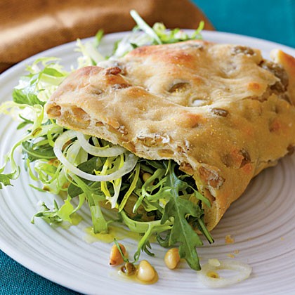 Olive piadine with arugula salad and caper vinaigrette