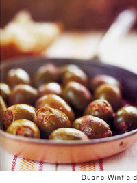 Olives stuffed with ground beef in piquant tomato ragout (Maraqat al-zaytun)
