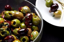 Olives with citrus zests and fried herbs