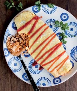 Omelet stuffed with tomatoey chicken rice (Omu raisu)