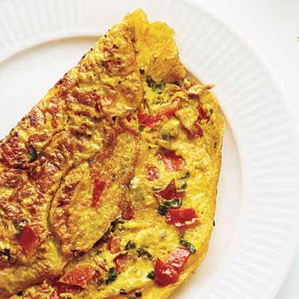 Omelet with turmeric, tomato, and onions