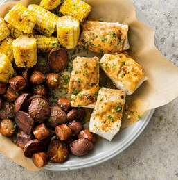 One-pan halibut with red potatoes, corn, and andouille