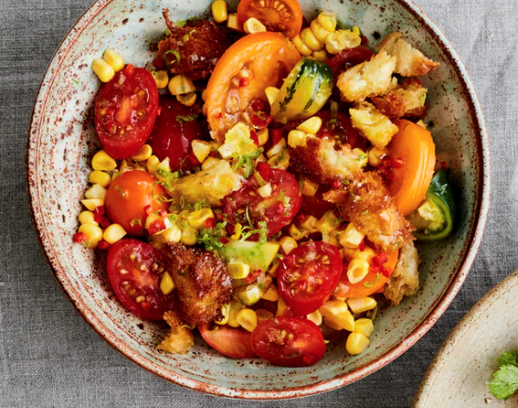 One tomato salad - four ways: corn, croutons, lime