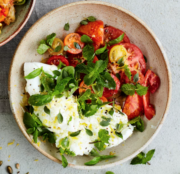 One tomato salad - four ways: goat's curd and toasted seeds