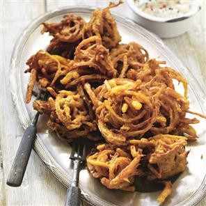 Onion bhajis with mango and kalonji raita