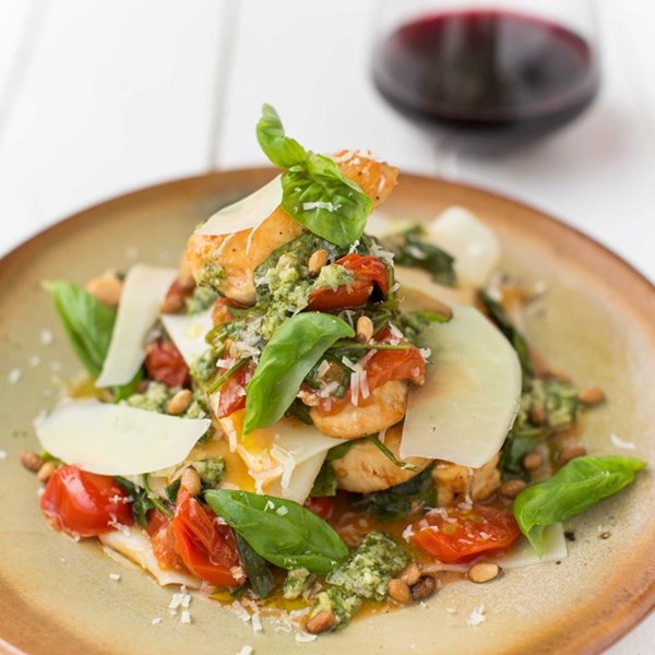Open chicken lasagne with cherry tomatoes and basil pesto