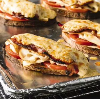 Open-faced chicken, bacon, and cheddar melts