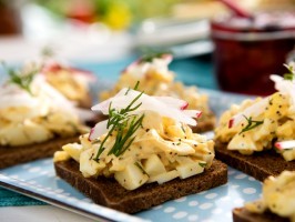 Open-faced egg salad tea sandwiches with crab and poppy seeds