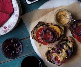 Open-faced grilled eggplant, red onion, and heirloom tomato sandwiches with creamy celeriac sauce